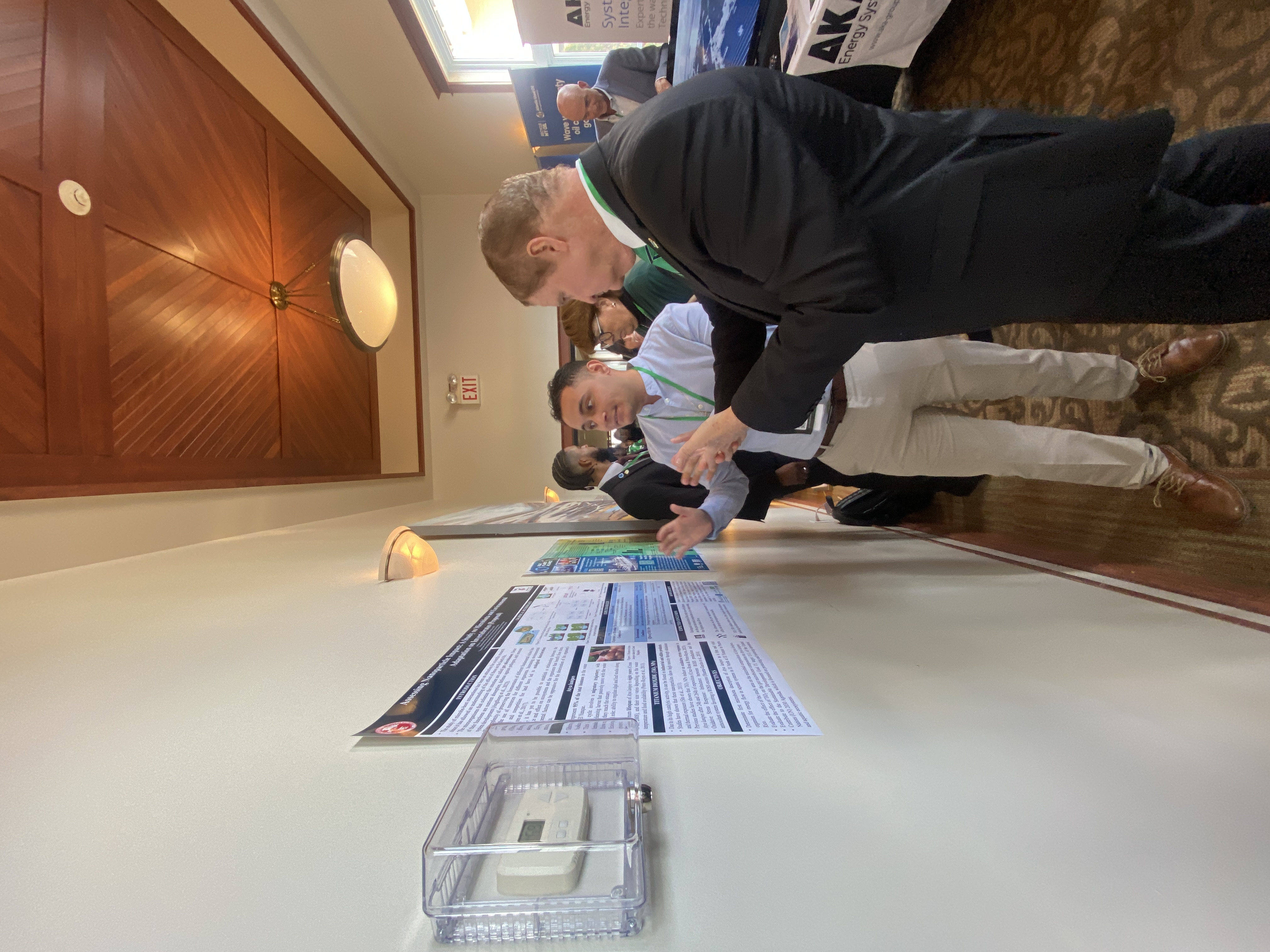 Anthony Martir, PhD candidate at the University of Puerto Rico, discusses his research with Mike Eman, Prime Minister of Aruba at the 2024 GSIS